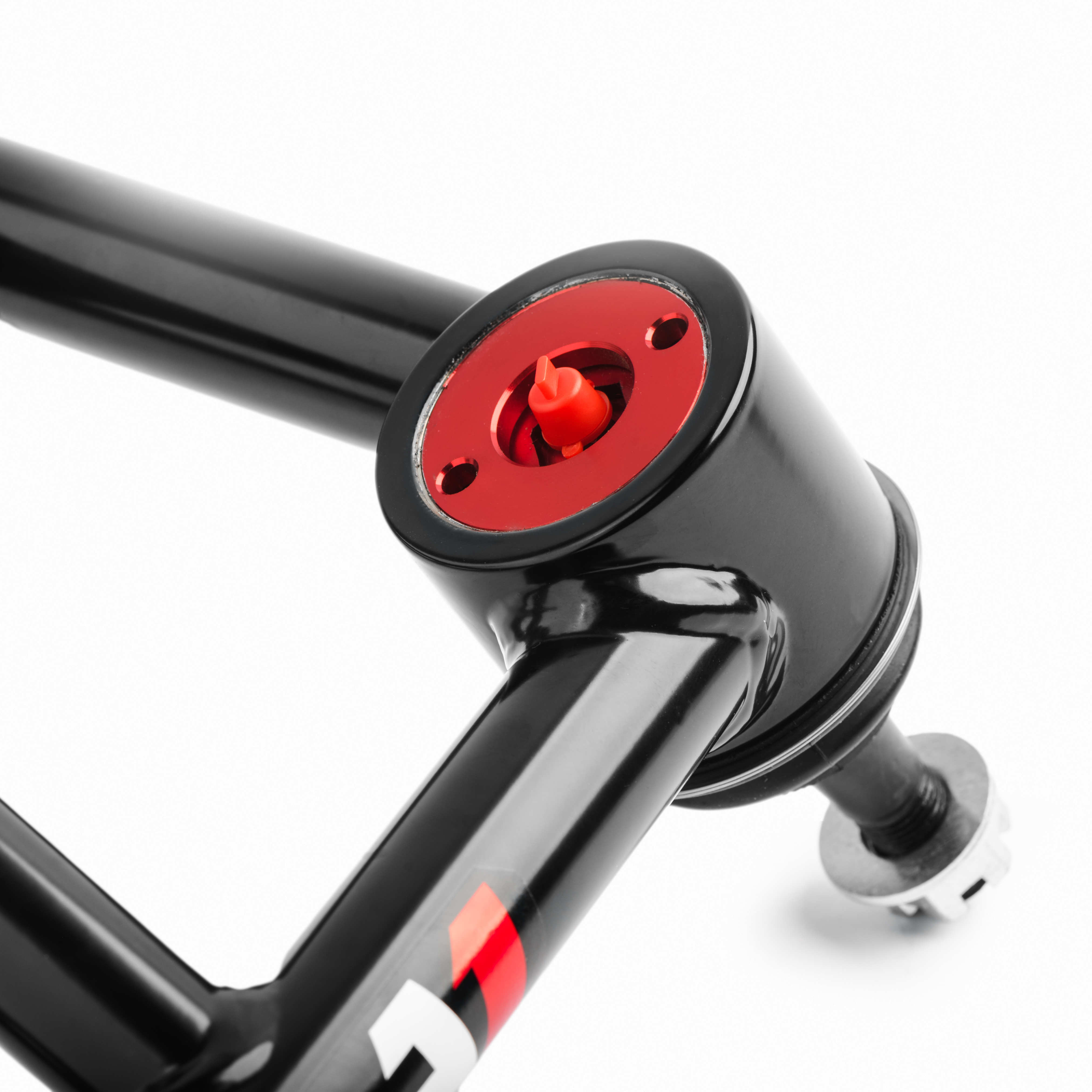 QA1's ball joint housing is integrated into the control arm itself.