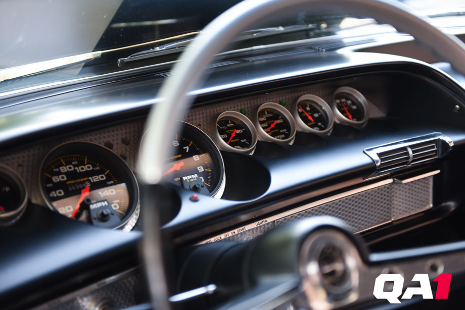 The dash and gauges inside a restored 1963 Chevrolet Impala.