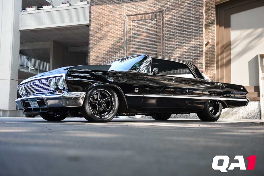 Black 1963 Chevrolet Impala with a big block Chevy engine and QA1 coilover suspension.