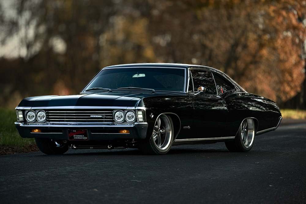 Front three-quarter view of Jordan Johnson’s 1967 Chevrolet Impala SS showcasing its deep black paint and Ridler wheels.