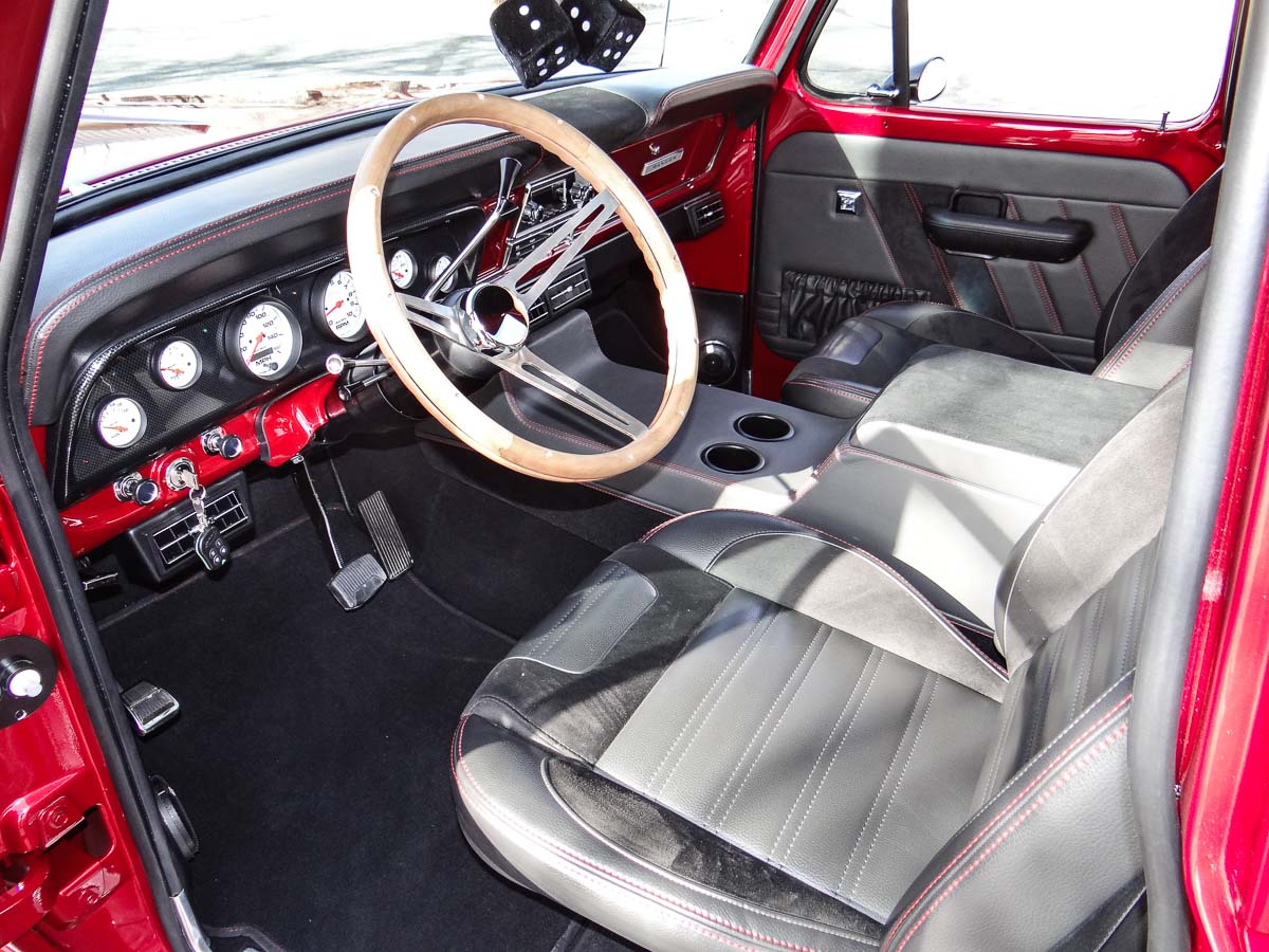 Interior shot of the 1968 Ford F100 Ranger, highlighting the clean factory styling and modern touches.