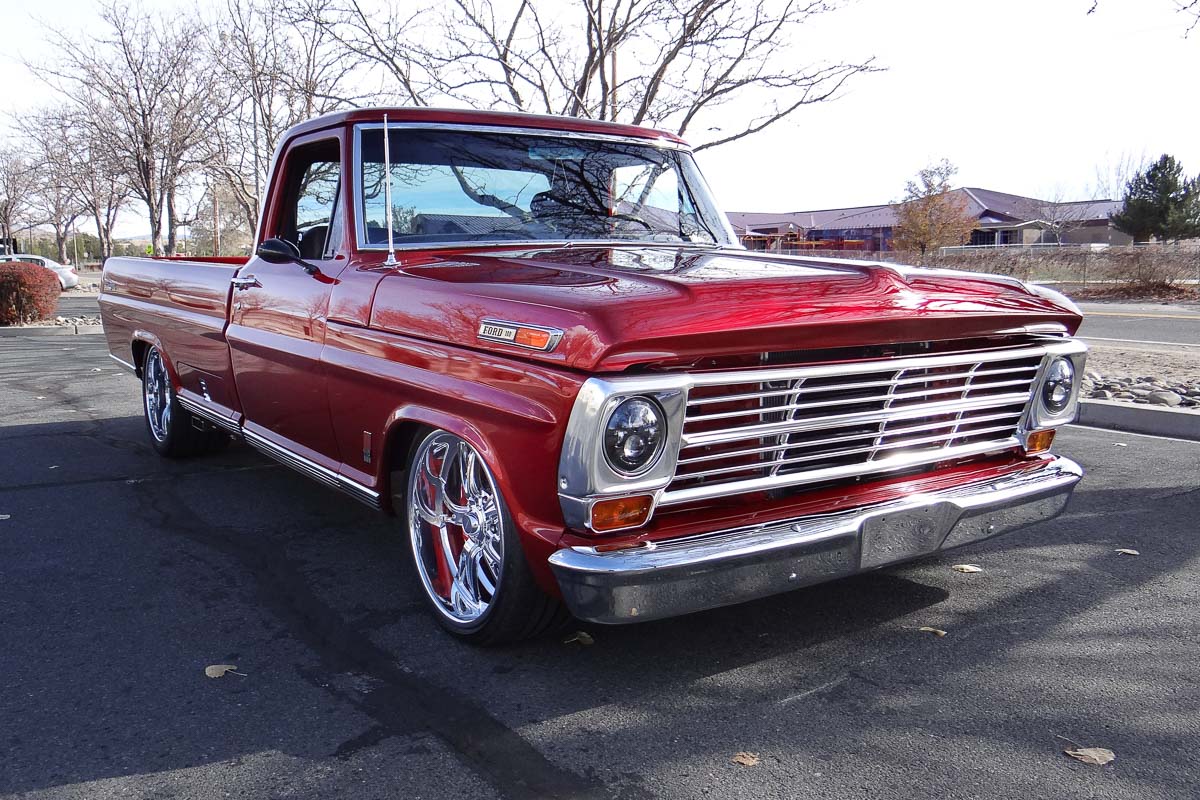 Front three-quarter view of Steve and Yelena Price’s 1968 Ford F100 Ranger, Ginger, painted in Rapid Red Metallic.