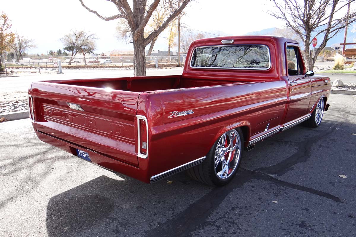 Side angle of the 1968 Ford F100 Ranger showcasing its lowered stance and clean body lines.