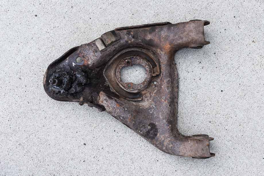 A factory OEM stamped steel control arm.