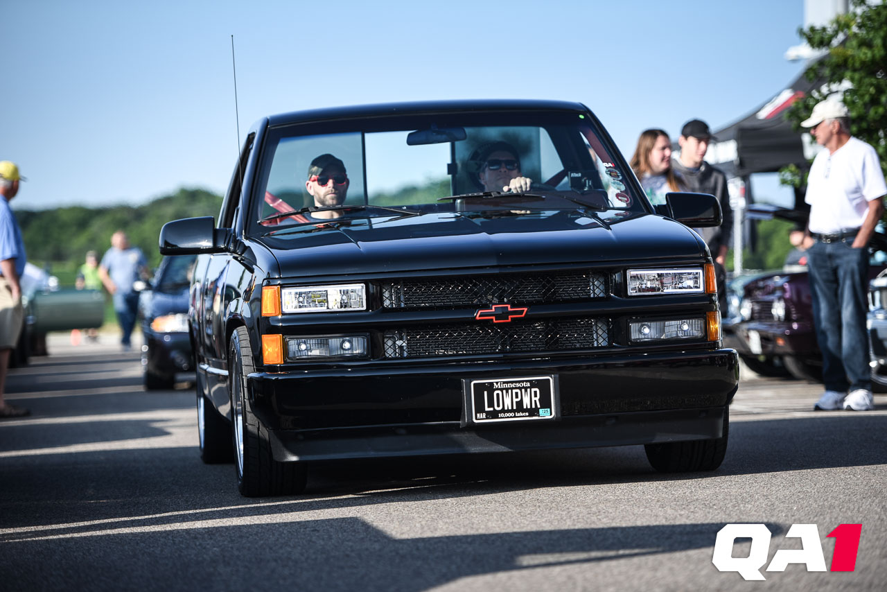 A GM Squarebody truck with a low, aggressive stance after adjusting the factory ride height with coilover shocks.