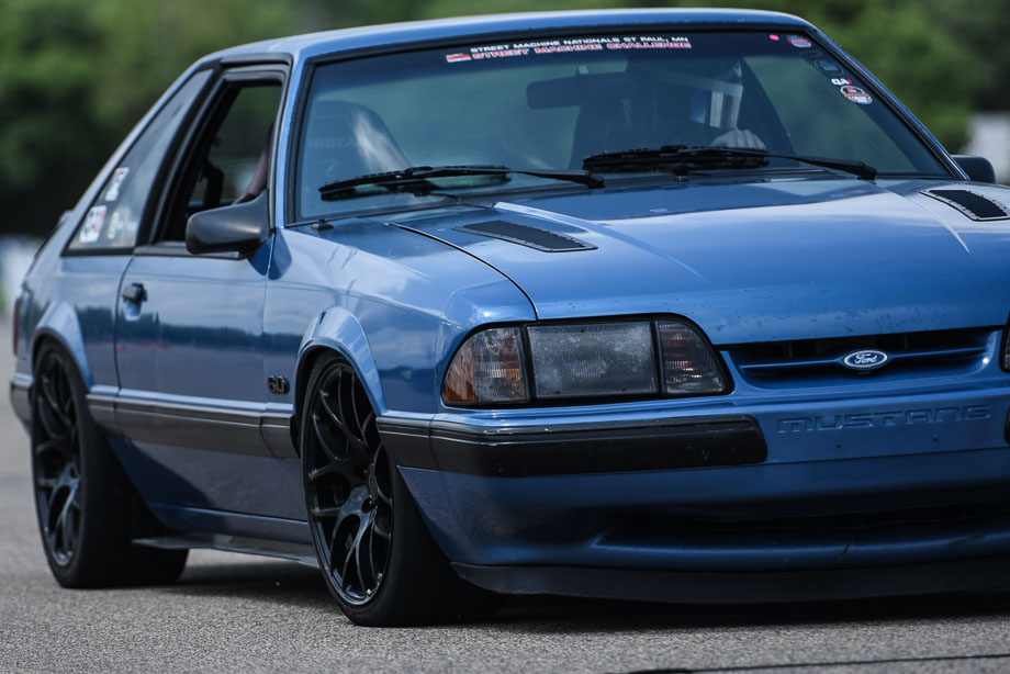 A Fox body Ford Mustang with QA1 suspension components on an autocross cross, where camber, caster, and toe settings are vital for proper control and handling.