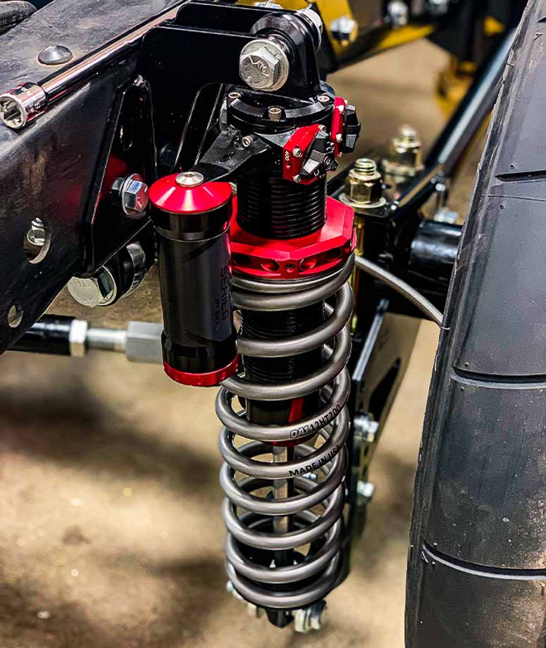 High-performance QA1 shocks with 4-way adjustability, allowing drivers to independently control compression and rebound settings for better handling. High-performance QA1 shocks with 4-way adjustability, allowing drivers to independently control compression and rebound settings for better handling.