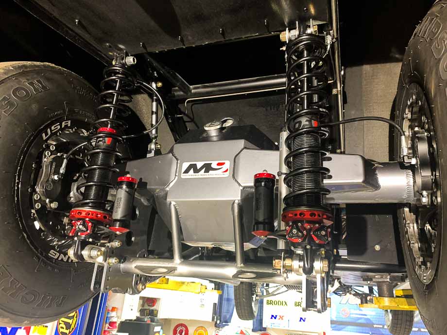 Image of QA1 MOD series shocks installed on a race vehicle, highlighting the ease of adjusting high and low-speed suspension settings. Image of QA1 MOD series shocks installed on a race vehicle, highlighting the ease of adjusting high and low-speed suspension settings.