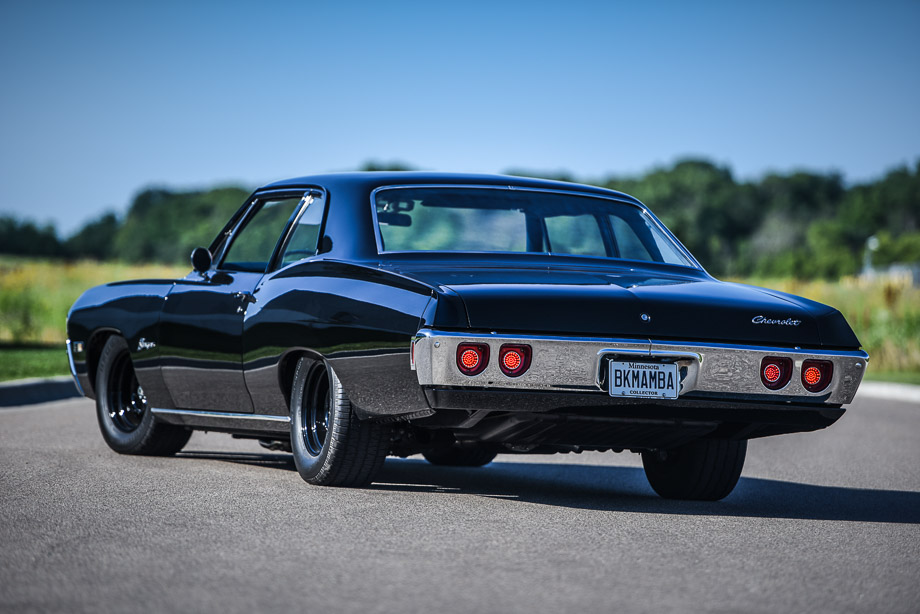 Rear view of a black 1968 Chevrolet Biscayne featuring QA1 suspension and a big-block Chevrolet engine.