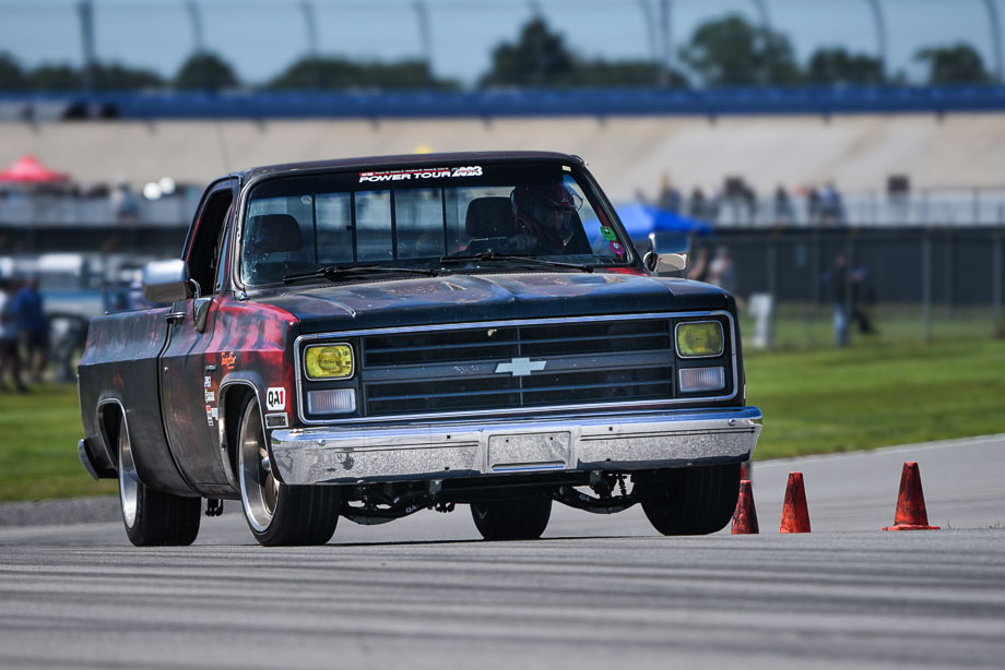 Chevrolet C10 pickup truck riding on QA1 coilover shocks around an autocross track.