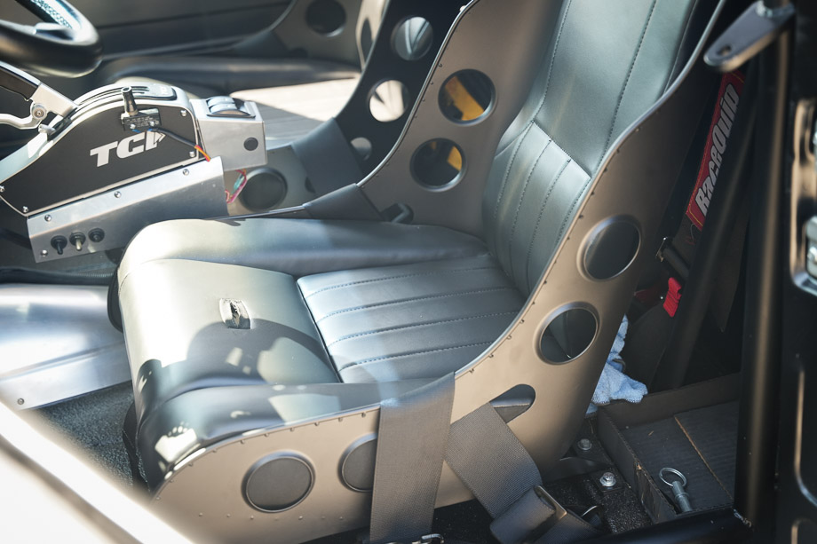 Interior of Rob McPherson’s Chevy 3100 with custom bomber seats and aluminum door panels.