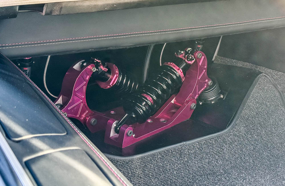 The Speedtech ExtReme independent rear suspension system features custom pink QA1 MOD Series coilover shocks.